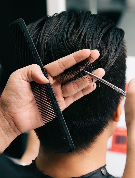 professional hairstylist styling client hair
