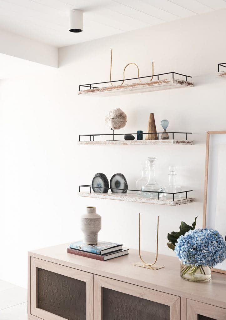 Luxury floating shelves made from premium solid oak grain matching against a contemporary dark accent wall