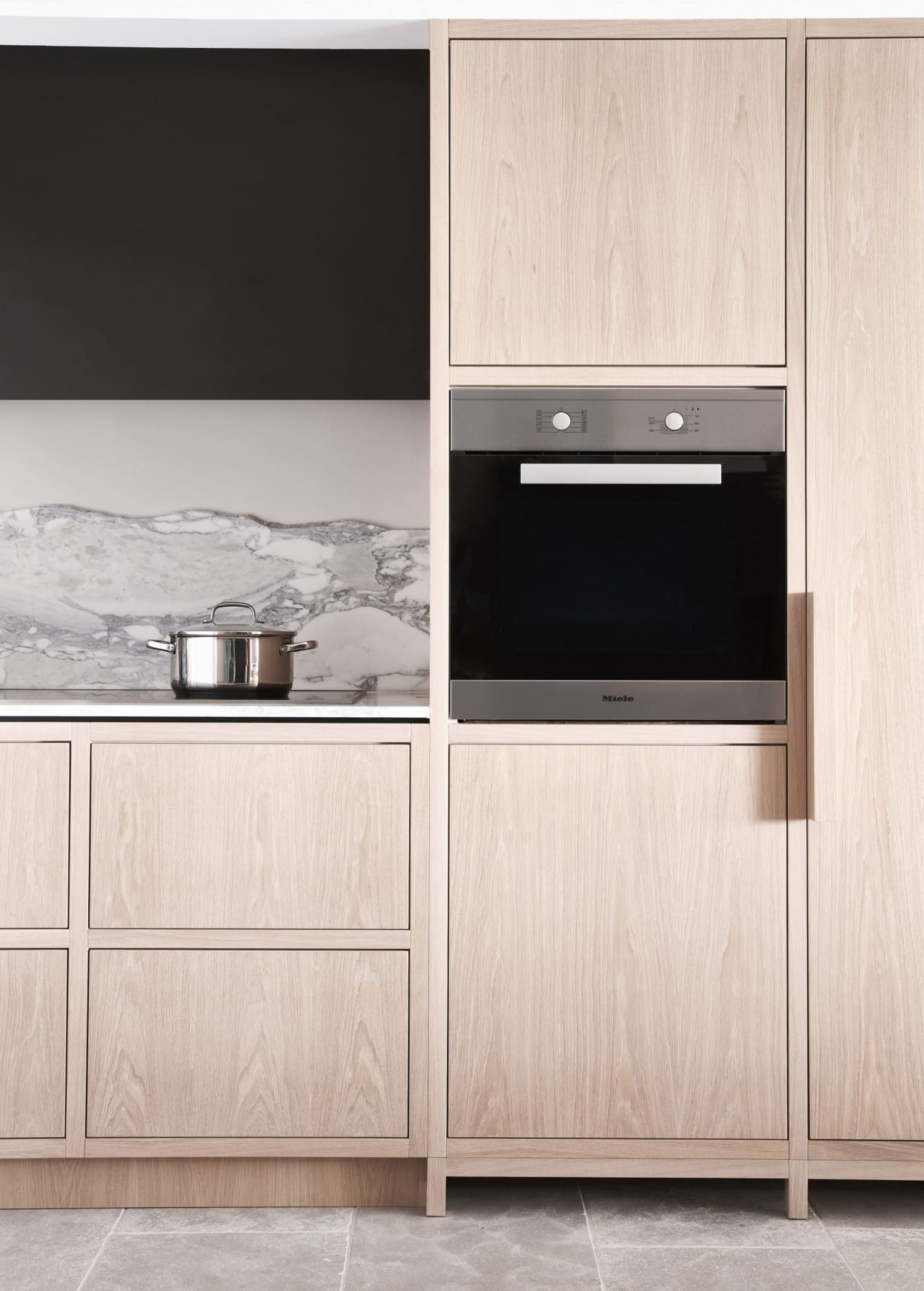 Handcrafted kitchen storage featuring intelligent timber pantry pull-outs and soft-close spice racks